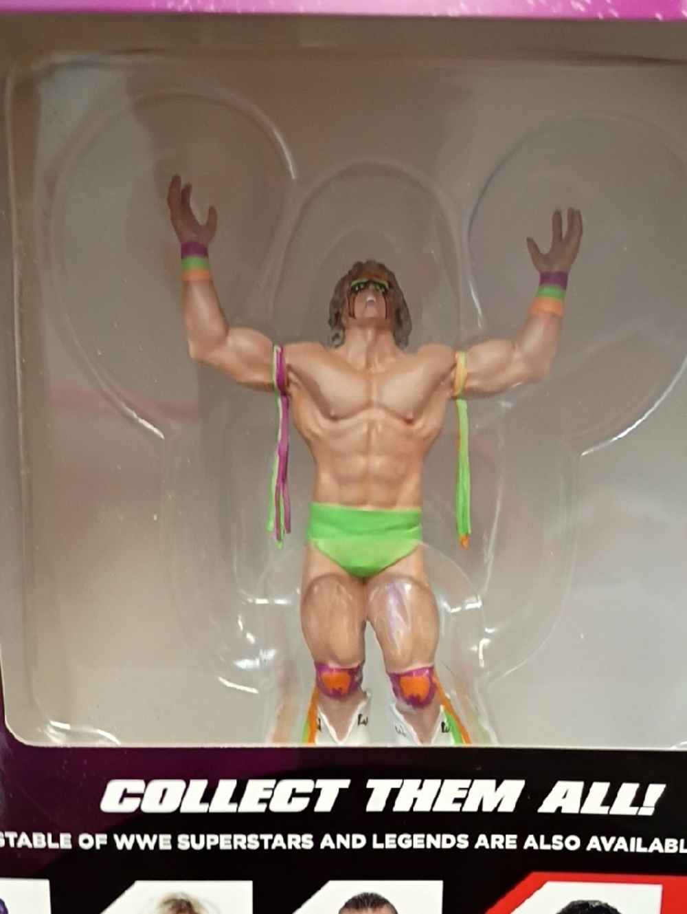 WWE Action Figure with Neon Green Trunks and Multicolor Accessories - Picture 2 of 3